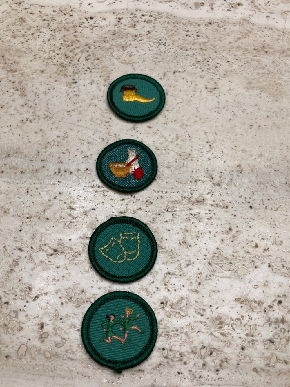 Four Vintage Girl Scout Badges